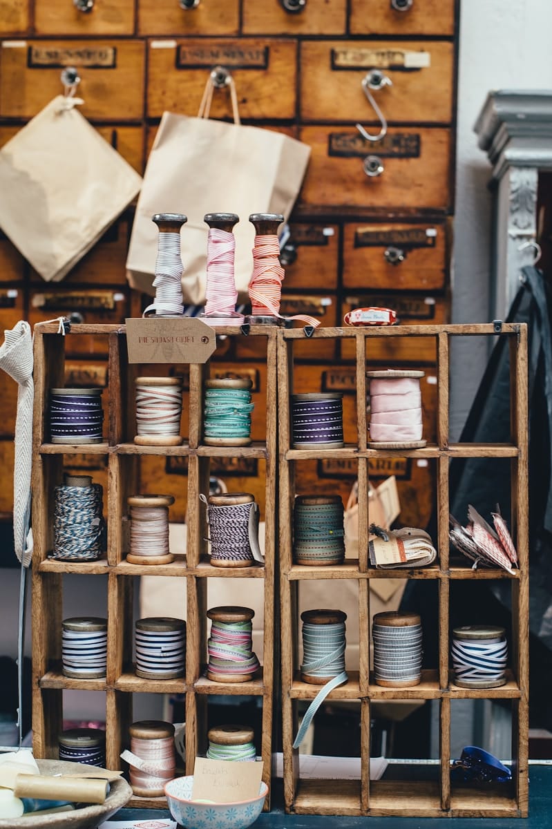 Photo by Annie Spratt assorted threads on rack